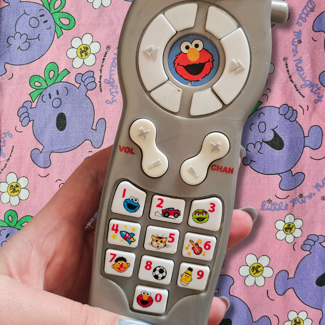 Fisher-Price Sesame Street Silly Sounds Giggle Remote (2006)
